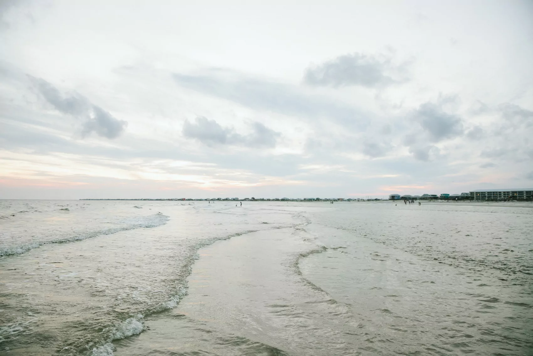 Ocean waters ripple with the coast in the background.